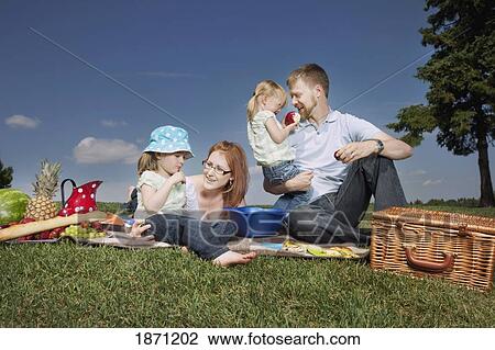 a family having a picnic View Large Photo Image Stock Image - a family having a picnic. Fotosearch