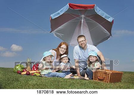 a family having a picnic View Large Photo Image Stock Photo - a family having a picnic. Fotosearch
