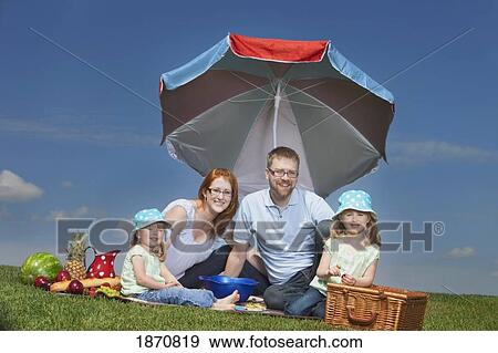a family having a picnic View Large Photo Image Stock Photo - a family having a picnic. Fotosearch