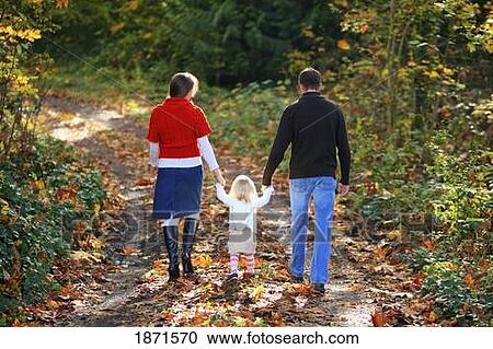 a family walking down a path in autumn View Large Photo Image Stock Image - a family walking down a path in autumn. Fotosearch