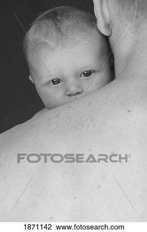 a father holding an infant View Large Photo Image Stock Image - a father holding an infant. Fotosearch