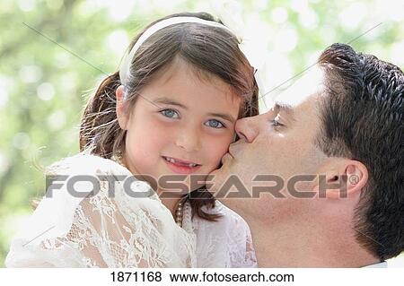 Stock Photo - a father kissing his daughter. Fotosearch