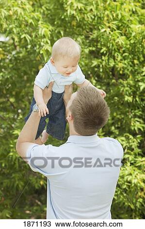 Stock Image - a father playing with his young son. Fotosearch