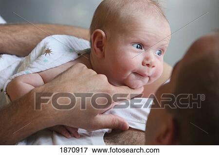 Stock Photo - a father with his infant. Fotosearch