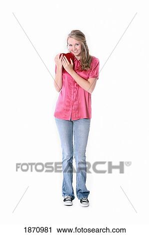 Stock Image - a girl holding a heart. Fotosearch