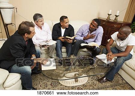 Stock Image - a group of men having a bible study. Fotosearch