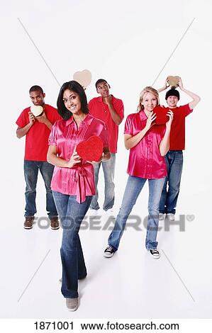 a group of teenagers holding hearts View Large Photo Image Stock Image - a group of teenagers holding hearts. Fotosearch