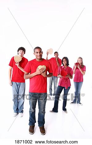 a group of teenagers holding hearts View Large Photo Image Stock Image - a group of teenagers holding hearts. Fotosearch
