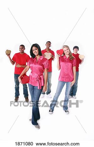 a group of teenagers holding hearts View Large Photo Image Stock Image - a group of teenagers holding hearts. Fotosearch
