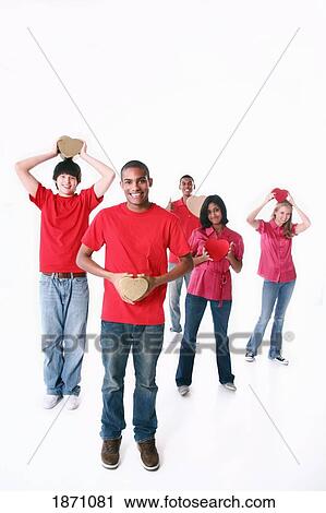 a group of teenagers holding hearts View Large Photo Image Stock Image - a group of teenagers holding hearts. Fotosearch
