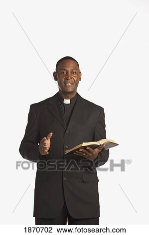a man wearing a clerical collar and preaching from the bible View Large Photo Image Stock Image - a man wearing a clerical collar and preaching from the bible. Fotosearch