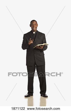 a man wearing a clerical collar and preaching from the bible View Large Photo Image Stock Image - a man wearing a clerical collar and preaching from the bible. Fotosearch