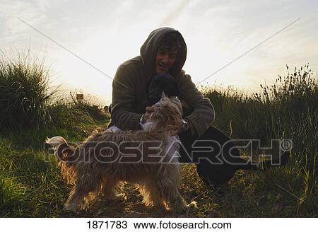 a man with his two dogs View Large Photo Image Stock Image - a man with his two dogs. Fotosearch
