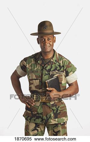 a military man holding a bible View Large Photo Image Stock Photography - a military man holding a bible. Fotosearch