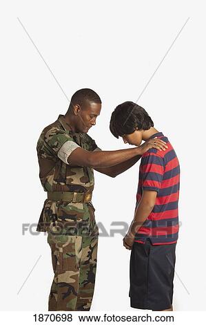 a military man praying for a teenage boy View Large Photo Image Stock Photo - a military man praying for a teenage boy. Fotosearch