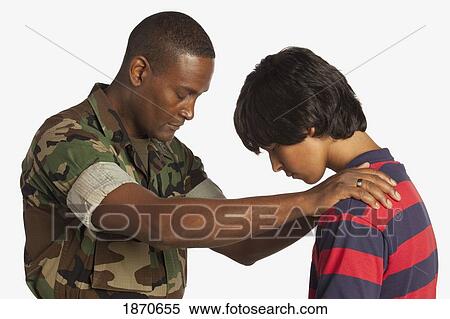 a military man praying for a teenage boy View Large Photo Image Stock Photography - a military man praying for a teenage boy. Fotosearch