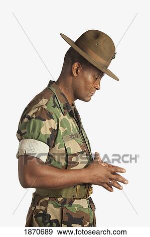 a military man with his head bowed in contemplation View Large Photo Image Stock Photo - a military man with his head bowed in contemplation. Fotosearch