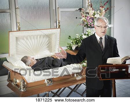 a minister conducting a funeral service View Large Photo Image Stock Photography - a minister conducting a funeral service. Fotosearch
