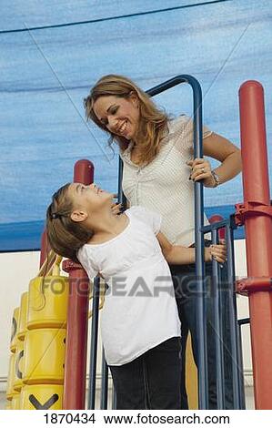 a mother and daughter at the playground View Large Photo Image Picture - a mother and daughter at the playground. Fotosearch