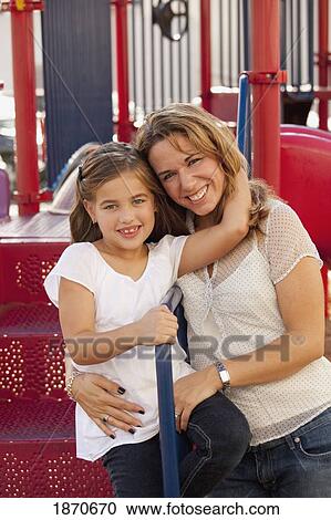a mother and daughter at the playground View Large Photo Image Stock Image - a mother and daughter at the playground. Fotosearch