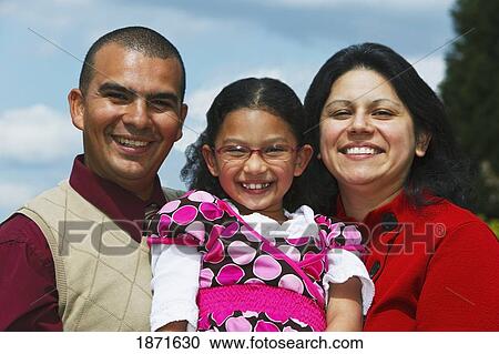 Stock Image - a mother and father with their daughter. Fotosearch