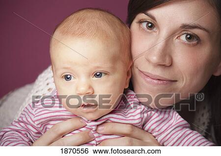 a mother and her infant daughter View Large Photo Image Stock Photograph - a mother and her infant daughter. Fotosearch
