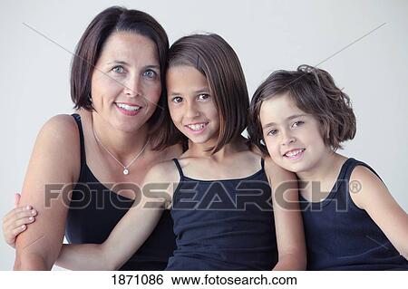 Stock Photograph - a mother and her two daughters. Fotosearch