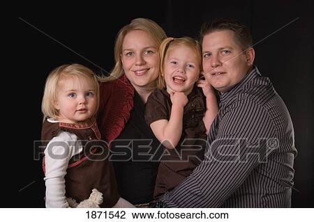 a mother, father and two daughters View Large Photo Image Stock Image - a mother, father and two daughters. Fotosearch