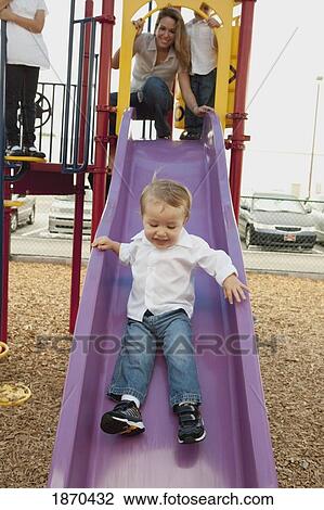 a mother playing at the playground with her children View Large Photo Image Stock Image - a mother playing at the playground with her children. Fotosearch