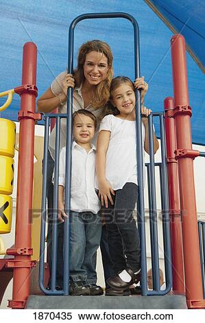 a mother with her two children at the playground View Large Photo Image Stock Photography - a mother with her two children at the playground. Fotosearch