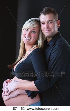 a pregnant woman and her husband View Large Photo Image Stock Image - a pregnant woman and her husband. Fotosearch