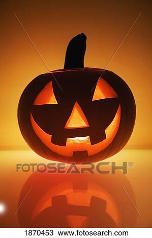 a pumpkin carved into a happy face View Large Photo Image Stock Image - a pumpkin carved into a happy face. Fotosearch
