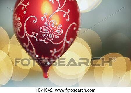 Stock Image - a red christmas tree ornament. Fotosearch