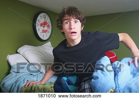 a teenage boy getting out of bed late View Large Photo Image Stock Image - a teenage boy getting out of bed late. Fotosearch