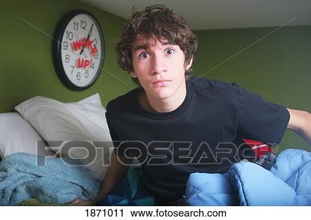 a teenage boy getting out of bed late View Large Photo Image Stock Image - a teenage boy getting out of bed late. Fotosearch