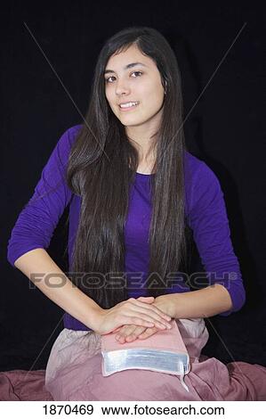 a teenage girl holding her bible View Large Photo Image Stock Photo - a teenage girl holding her bible. Fotosearch
