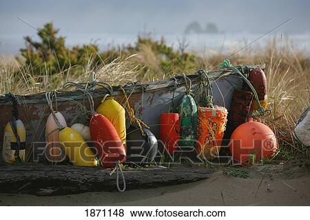 Stock Photo - a variety of buoys tied to the side of a boat. Fotosearch