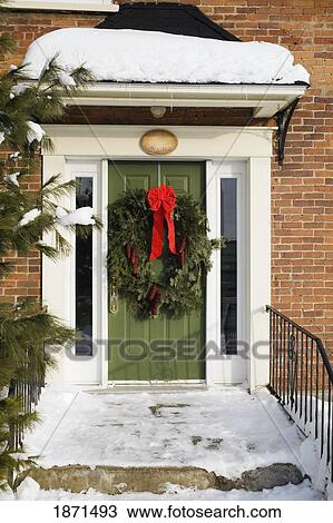 a wreath on the front door in winter View Large Photo Image Stock Image - a wreath on the front door in winter. Fotosearch