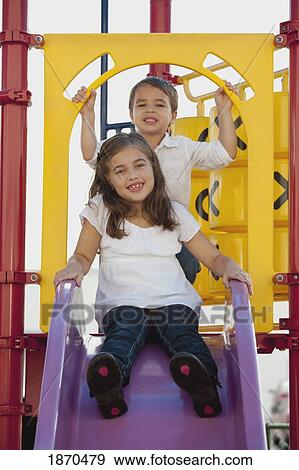 a young boy and girl at the playground View Large Photo Image Stock Photo - a young boy and girl at the playground. Fotosearch