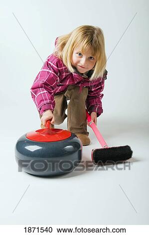 a young girl curling View Large Photo Image Stock Image - a young girl curling. Fotosearch