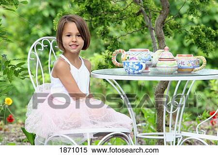a young girl having a tea party View Large Photo Image Stock Photography - a young girl having a tea party. Fotosearch