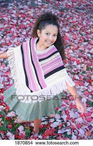 a young girl standing on leaves in her bare feet View Large Photo Image Picture - a young girl standing on leaves in her bare feet. Fotosearch