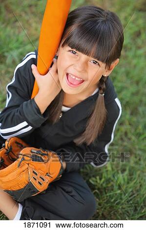 a young girl with a baseball bat and glove View Large Photo Image Stock Image - a young girl with a baseball bat and glove. Fotosearch