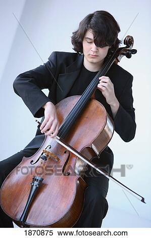 a young man playing a cello View Large Photo Image Stock Photography - a young man playing a cello. Fotosearch