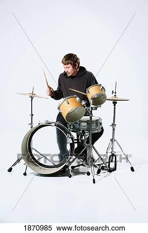 a young man playing the drums View Large Photo Image Stock Photography - a young man playing the drums. Fotosearch