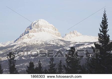 Stock Image - alberta, canada; crowsnest mountain in the crowsnest pass in winter. Fotosearch