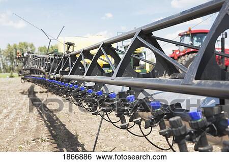 alberta, canada; sprayers in a field View Large Photo Image Stock Photograph - alberta, canada; sprayers in a field. Fotosearch