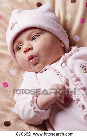an infant girl with a surprised expression on her face View Large Photo Image Stock Image - an infant girl with a surprised expression on her face. Fotosearch