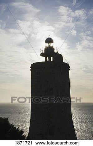 Stock Image - andalusia, spain; a lighthouse on the costa de la luz near zahara de los atunes. Fotosearch