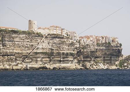 Stock Photo - bonifacio, corsica, france; white cliffs along the shoreline and houses on the cliffs. Fotosearch